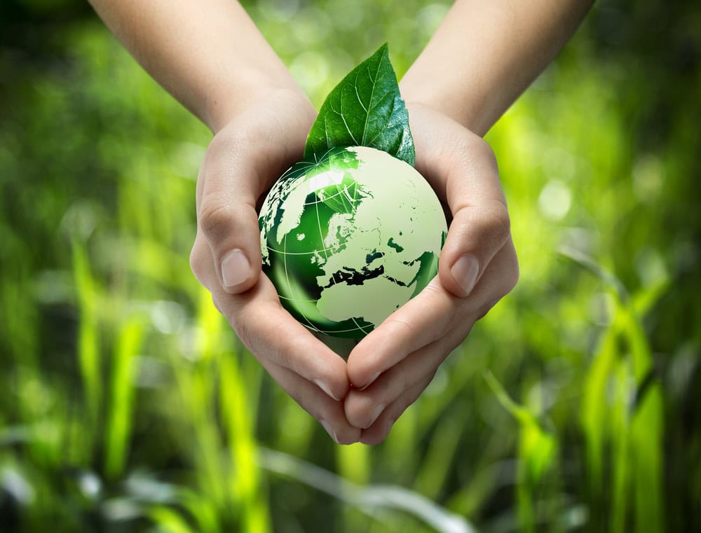 saving energy with planet in hands by being more efficient for the environment