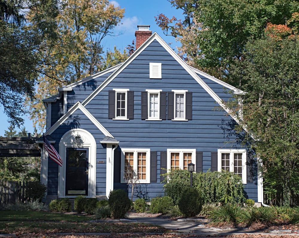 two story home in new england or a suburban town outside of the city where insulation is installed to keep the house more comfortable and efficient
