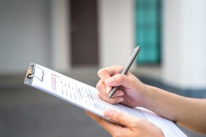 inspection of home during a mass save no-cost energy assessment to lower utility bills and keep home more comfortable throughout the year