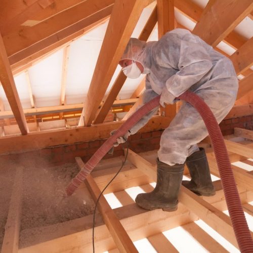 Worker,With,A,Hose,Is,Spraying,Ecowool,Insulation,In,The