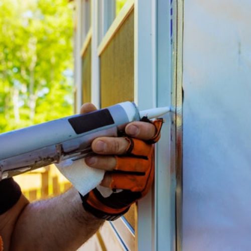 air sealing the outside of a home window using professional work and materials from AVID Energy Solutions in methuen